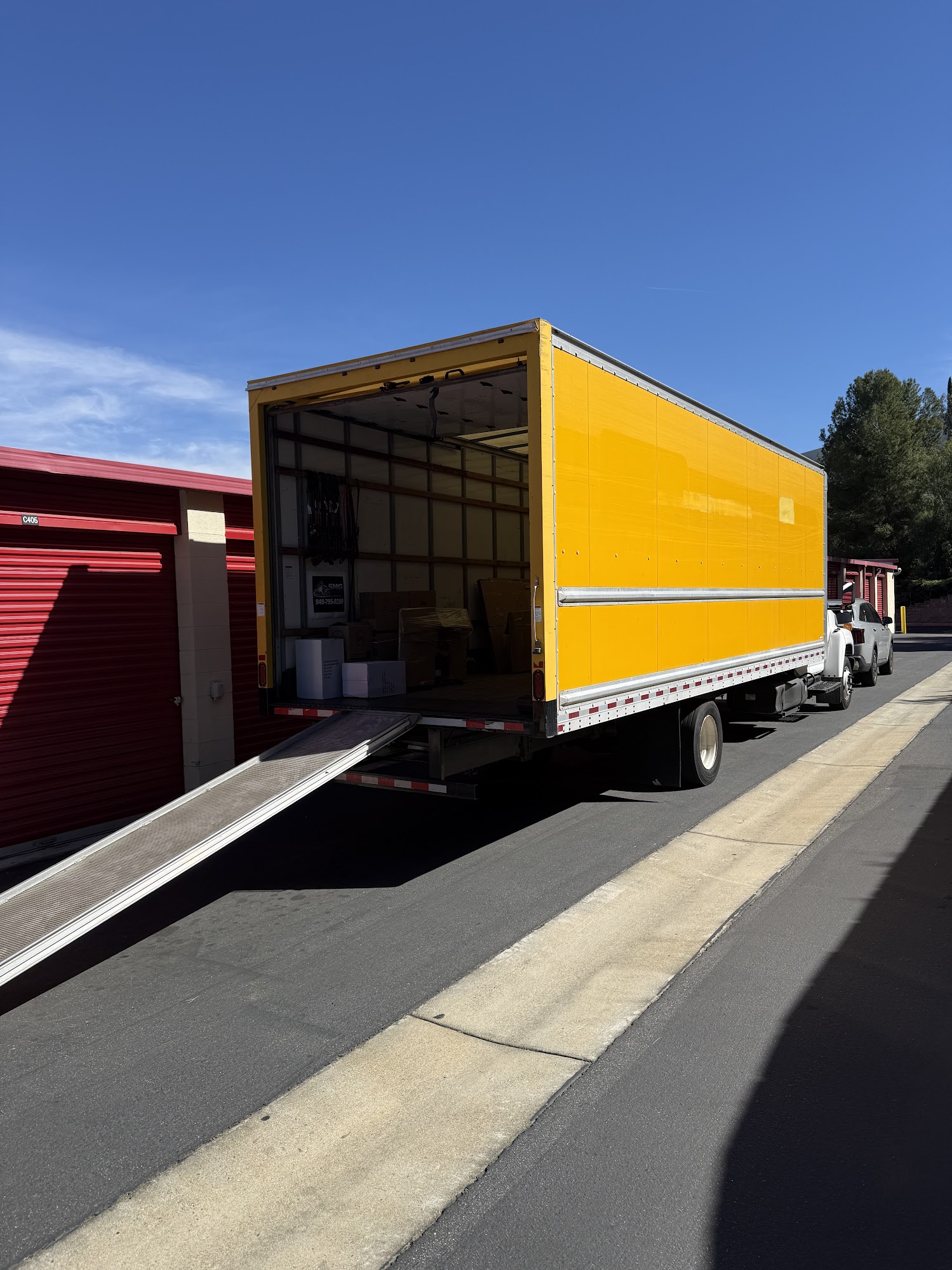 Thick moving blankets and shrink wrap securing wooden bedroom dresser in Newport Beach