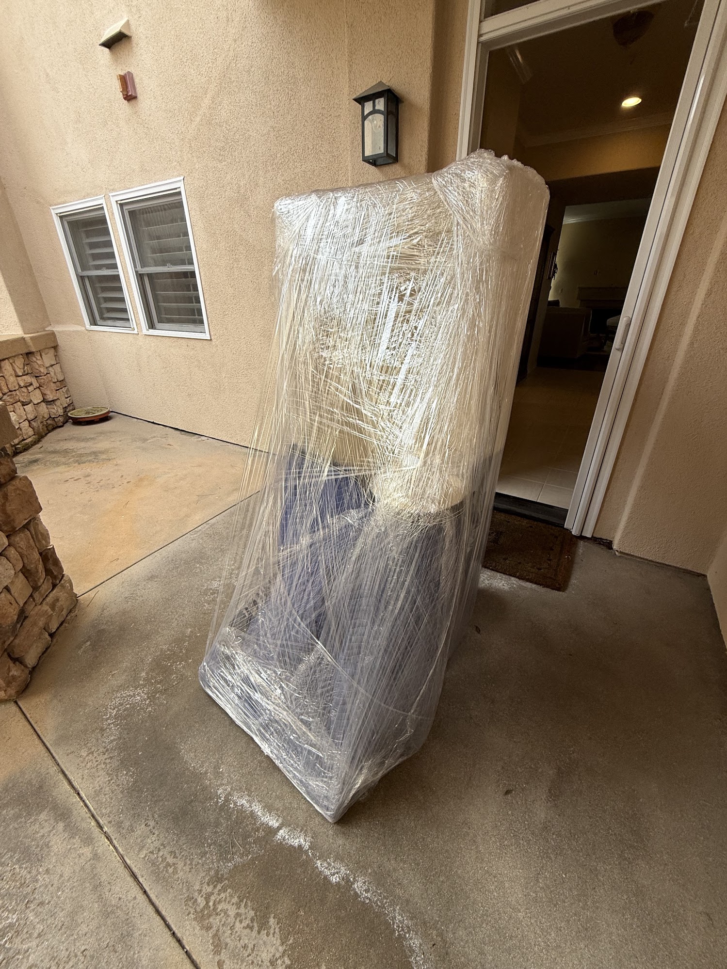 Heavy household appliance moving using commercial dolly and straps in Laguna Hills