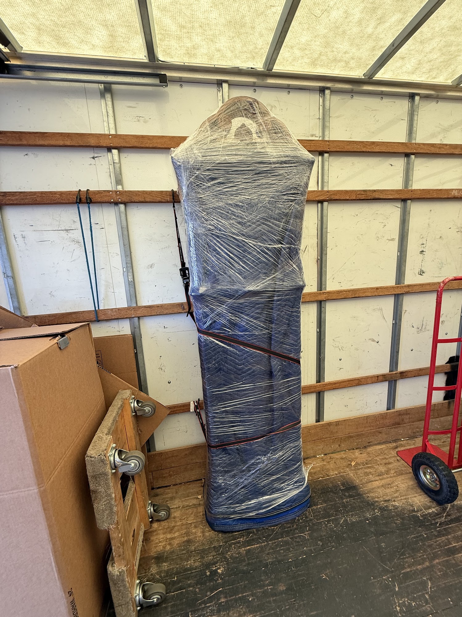 Professional movers wrapping items for safe transport in Orange County