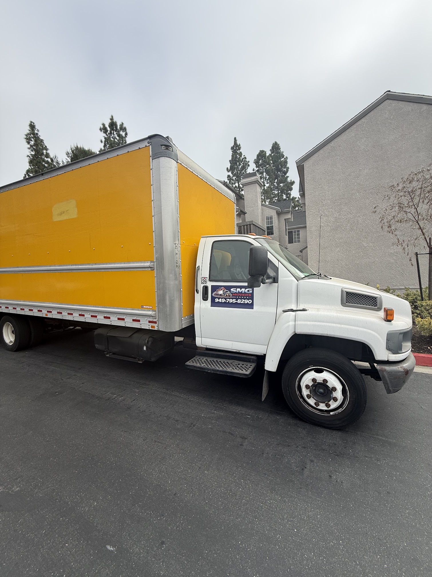 SMG Movers & Cleaning LLC loading 26-ft truck for Irvine relocation