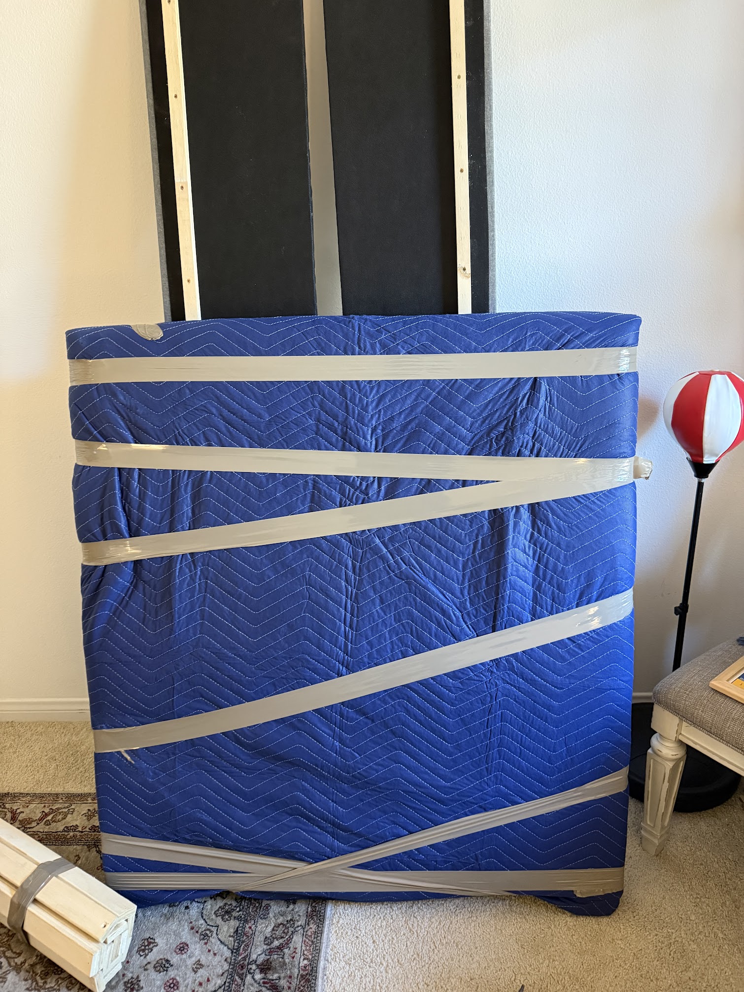 Professional movers wrapping items for safe transport in Orange County