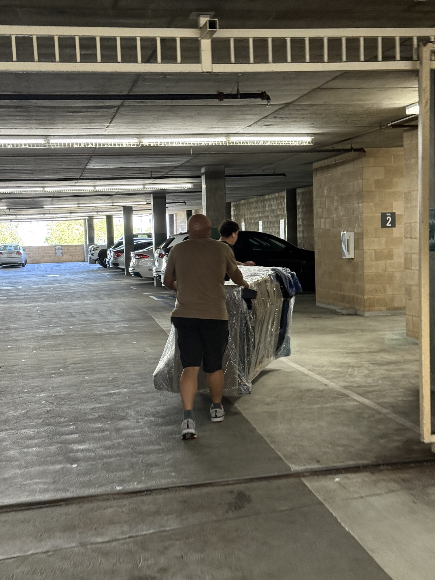 SMG Movers & Cleaning LLC team loading furniture into truck in Irvine, CA