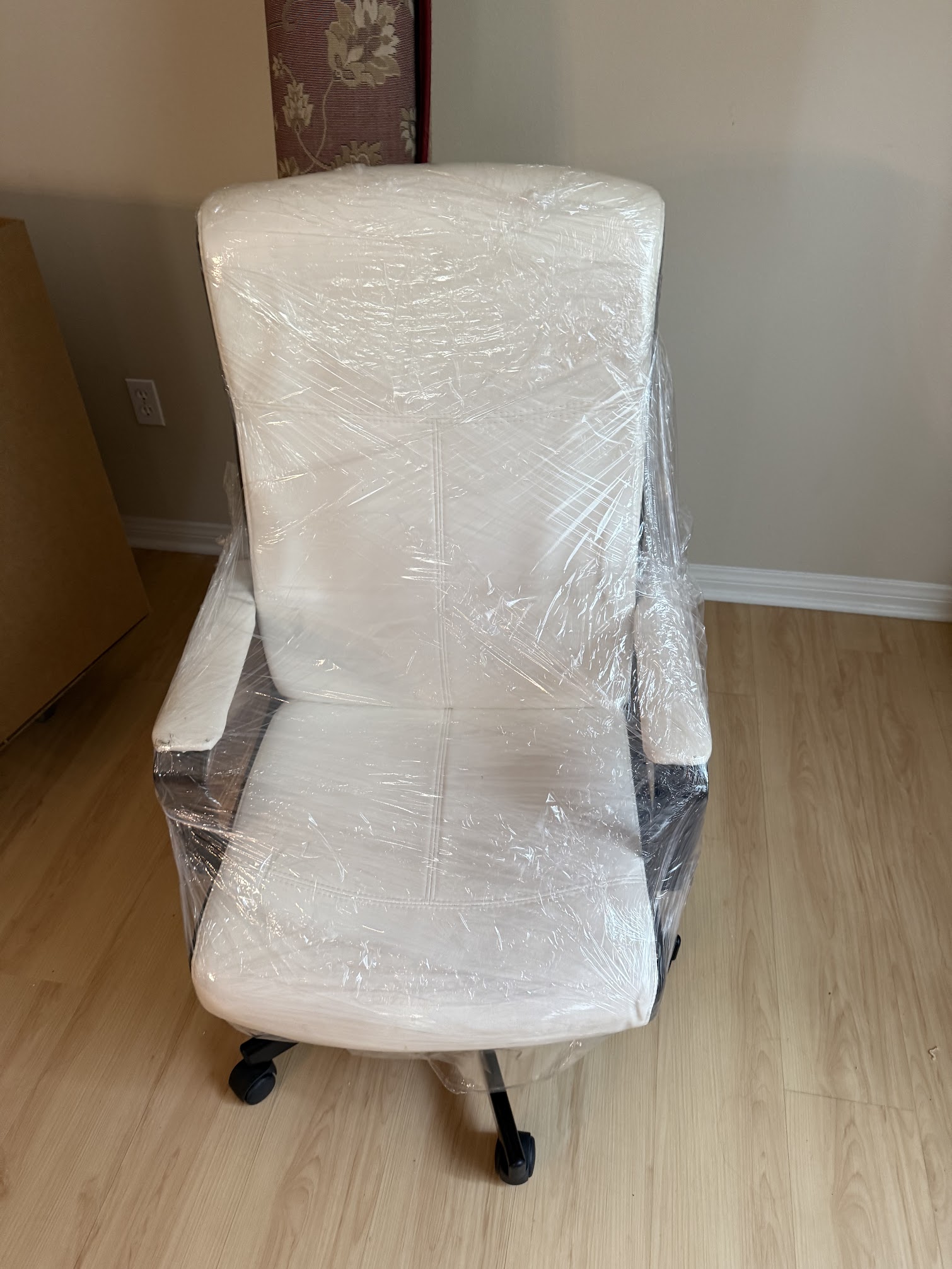 Professional movers wrapping items for safe transport in Orange County